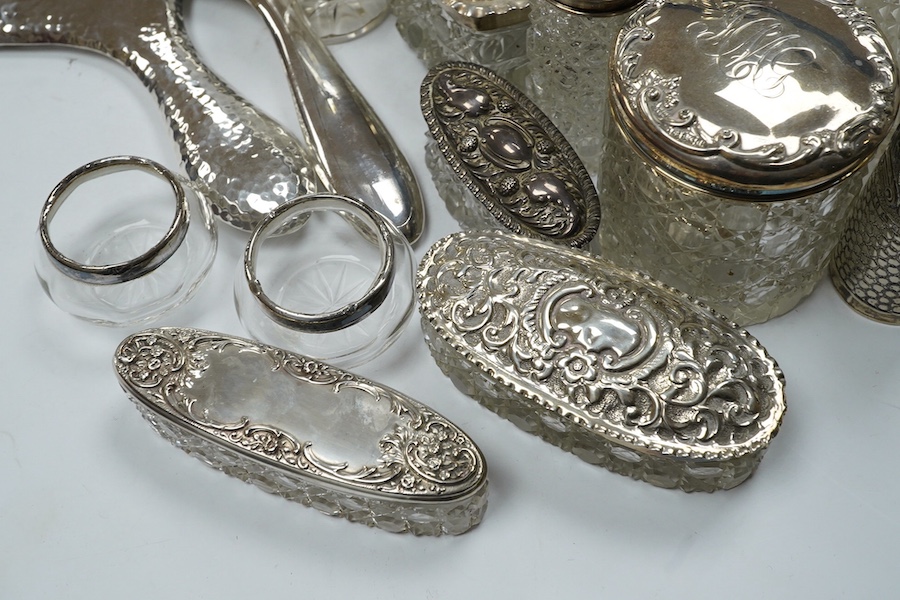 Two silver mounted hand mirrors and a collection of seventeen assorted silver mounted toilet jars. Condition - poor to fair